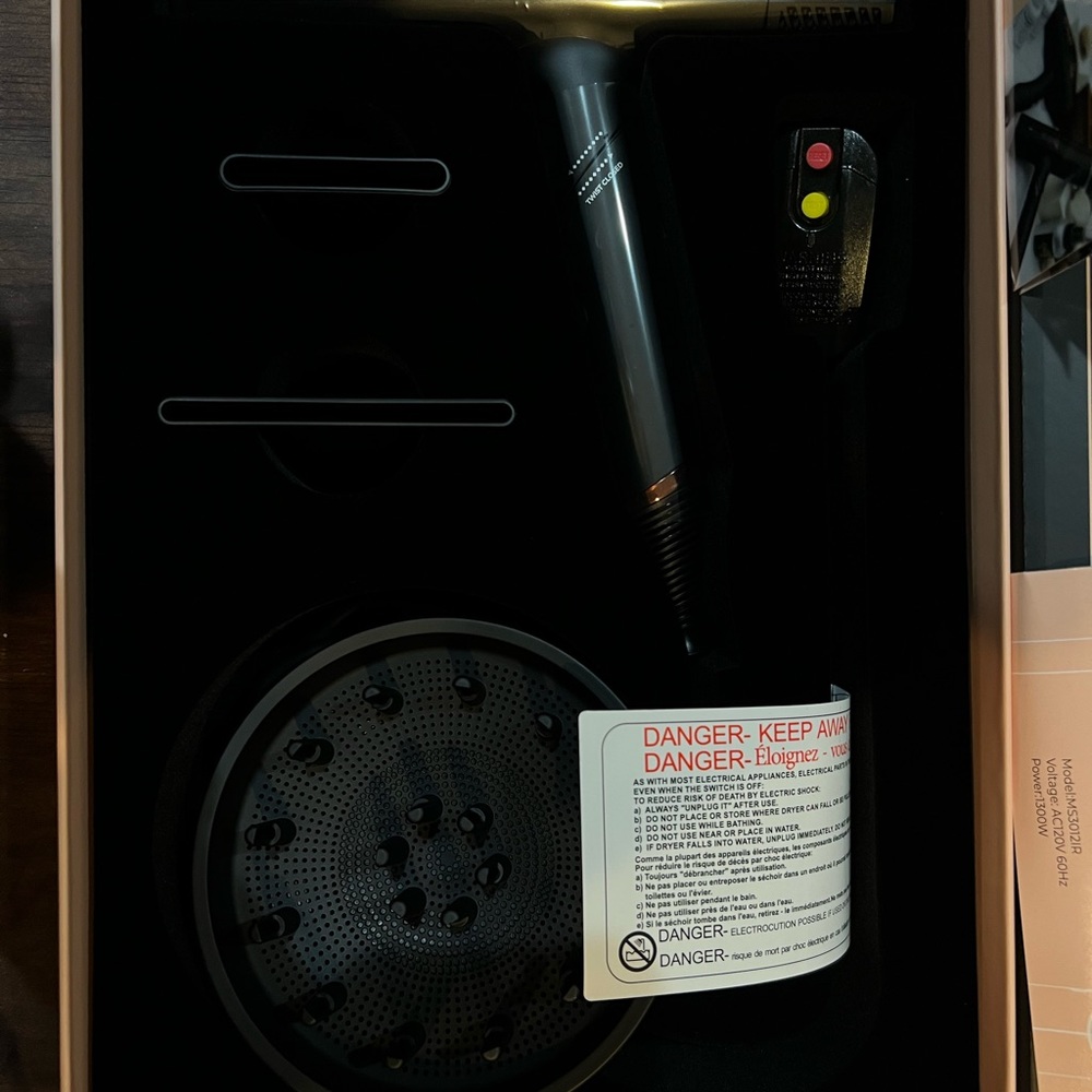 - - Brand New professional SRI Q hair dryer.